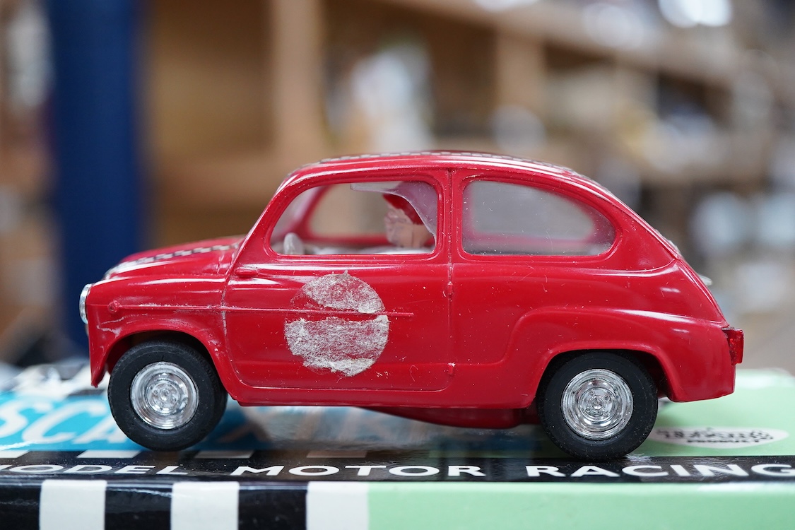 A boxed Tri-ang Scalextric T. C. Seat 600 (C-31) in red, with correct red spot box, together with an unboxed Hurricane combination motorcycle and sidecar MM/82